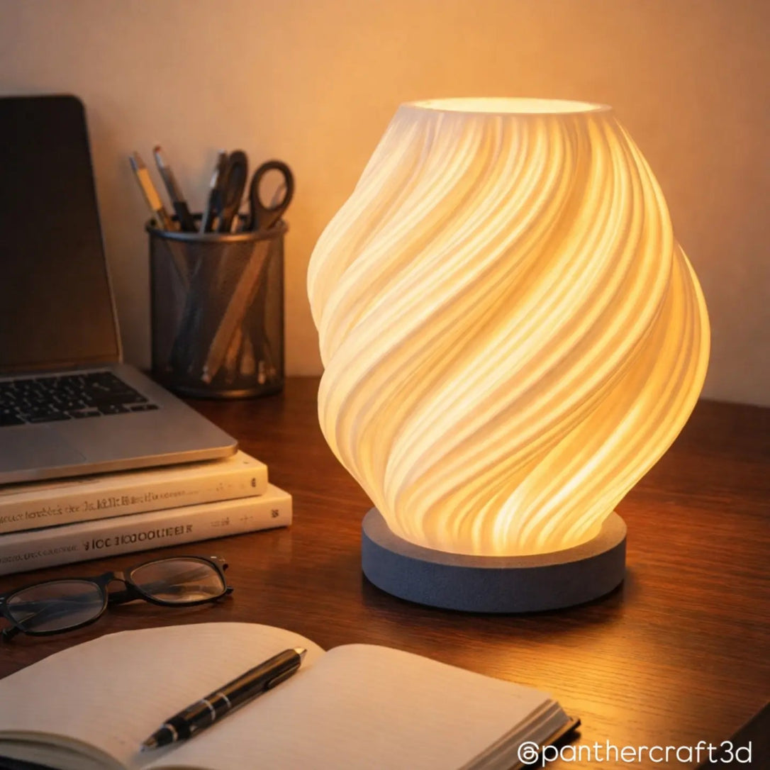 Decorative lamp on a desk with laptop, books, and stationery items.